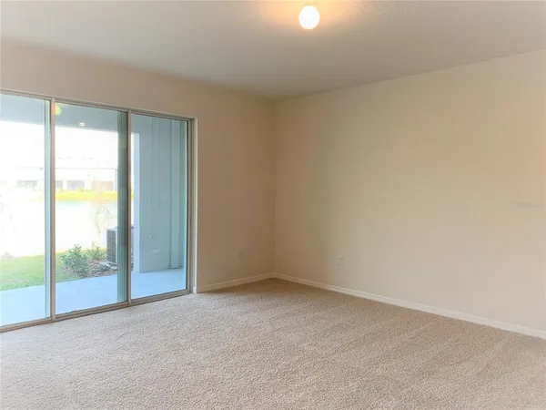 an empty room with glass door