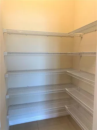 a view of an empty walk in closet