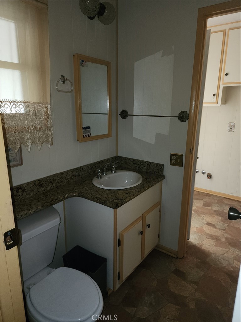 13393 Mariposa Road, Unit 181 Victorville, CA 92395 - Photo 18 of 19 a bathroom with a sink toilet and shower
