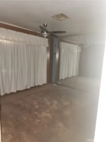 a view of a room with stairs and a window