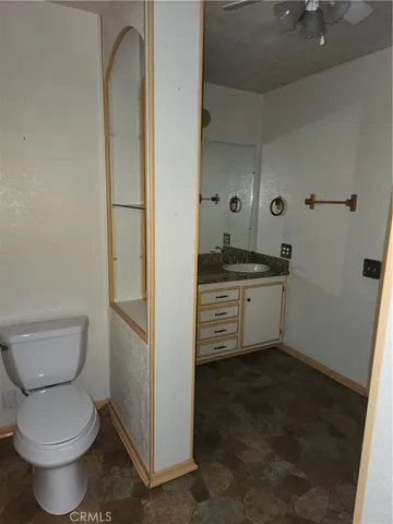 a bathroom with a toilet sink and shower