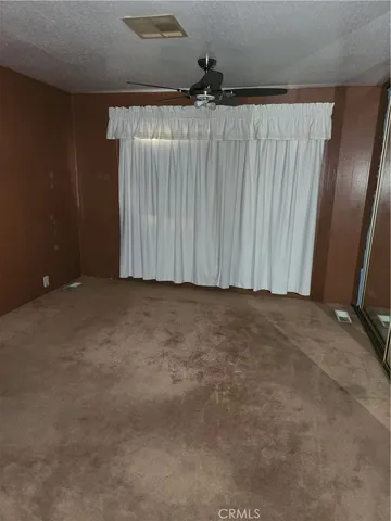 an empty room with a wooden door