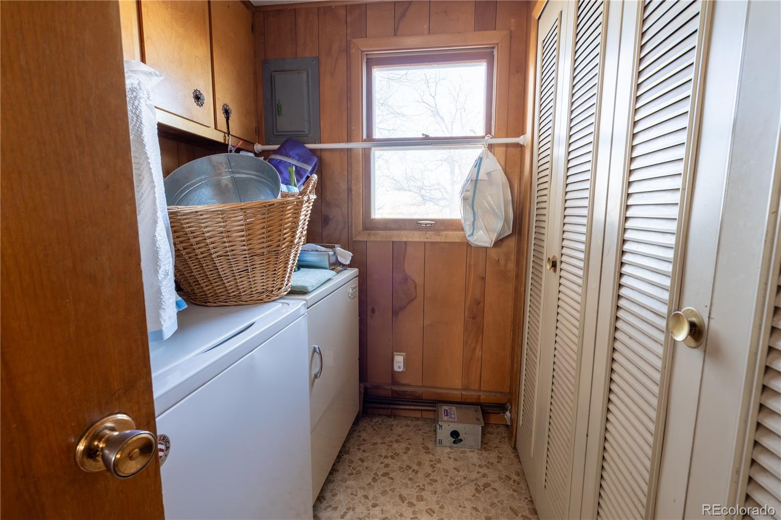 12169 East Baseline Road Lafayette, CO 80026 - Photo 17 of 32 a bathroom with a granite countertop sink and a window