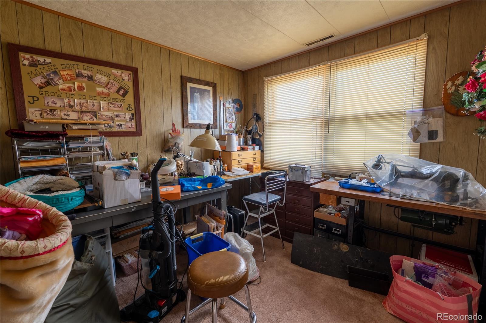 12169 East Baseline Road Lafayette, CO 80026 - Photo 19 of 32 a room with furniture a rug and a window