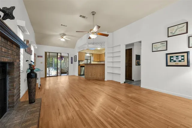 a view of a kitchen with a sink and a refrigerator