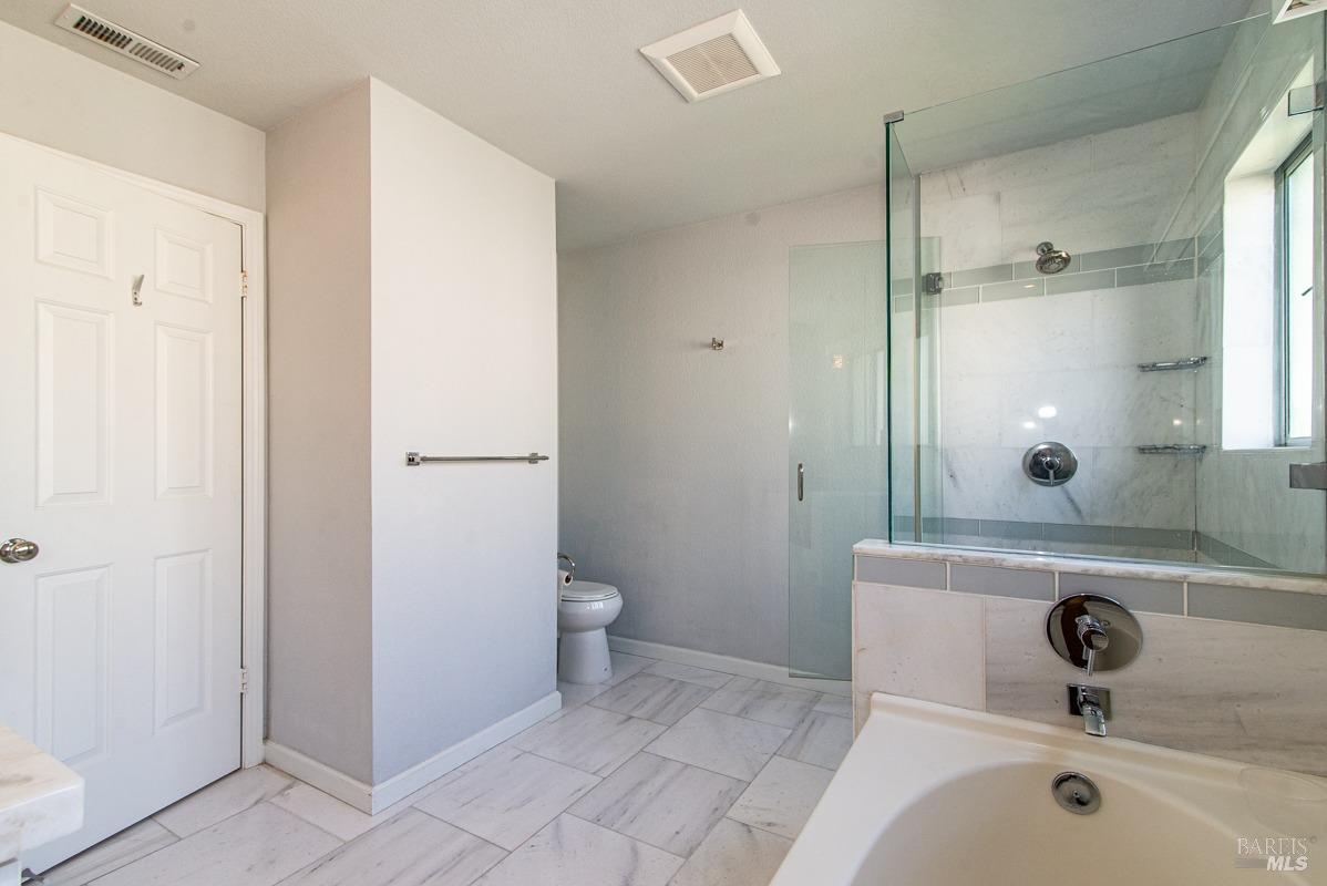 23 Baypoint Drive San Rafael, CA 94901 - Photo 23 of 40 a bathroom with a sink and a mirror