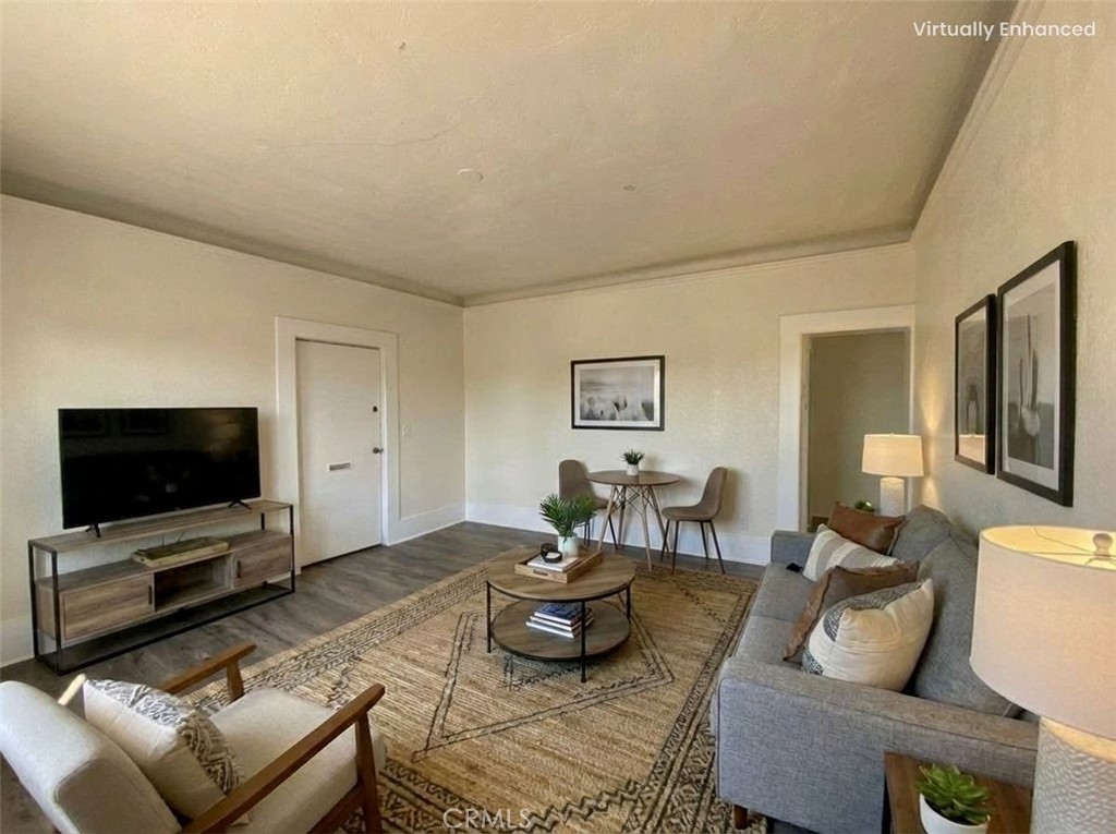 800 Pacific Avenue, Unit 300 Long Beach, CA 90813 - Photo 2 of 20 a living room with furniture and a flat screen tv