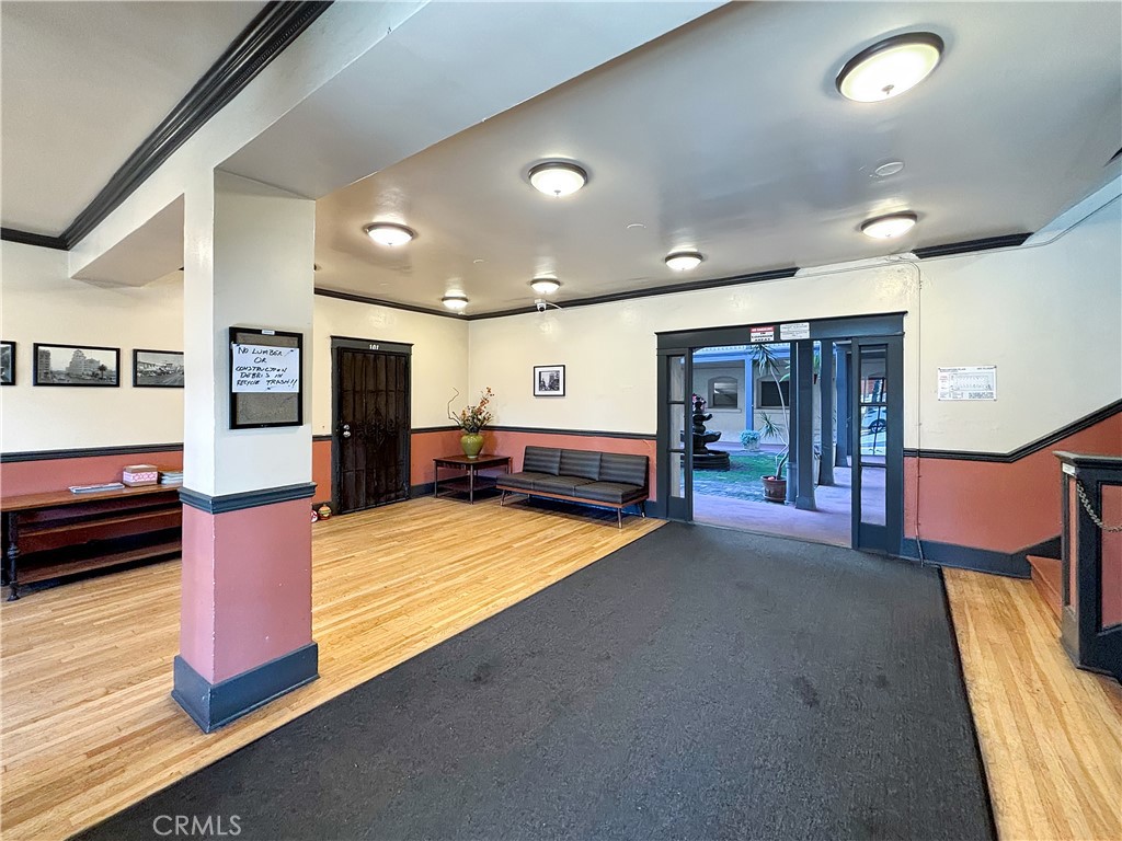 800 Pacific Avenue, Unit 300 Long Beach, CA 90813 - Photo 10 of 20 a lobby with furniture and a flat screen tv