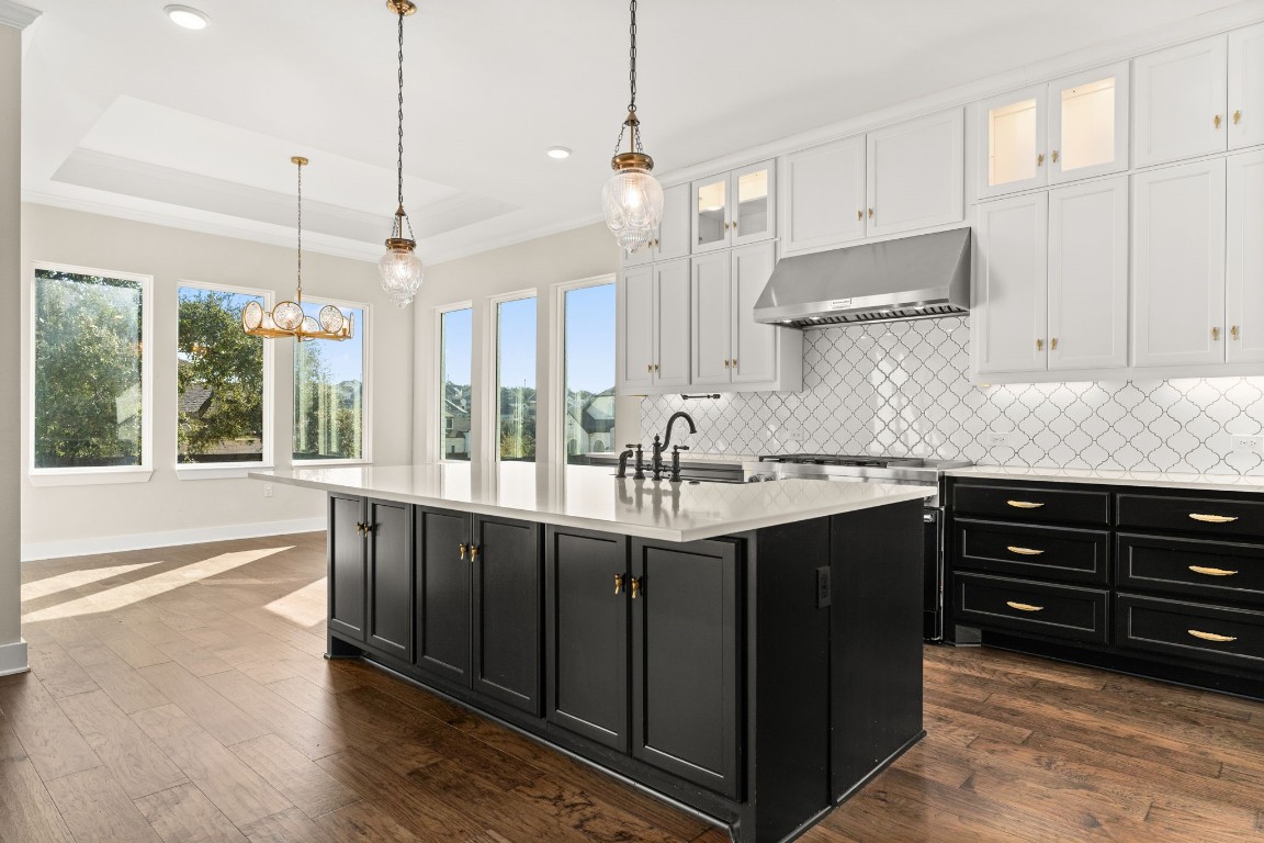 a kitchen with a sink and cabinets