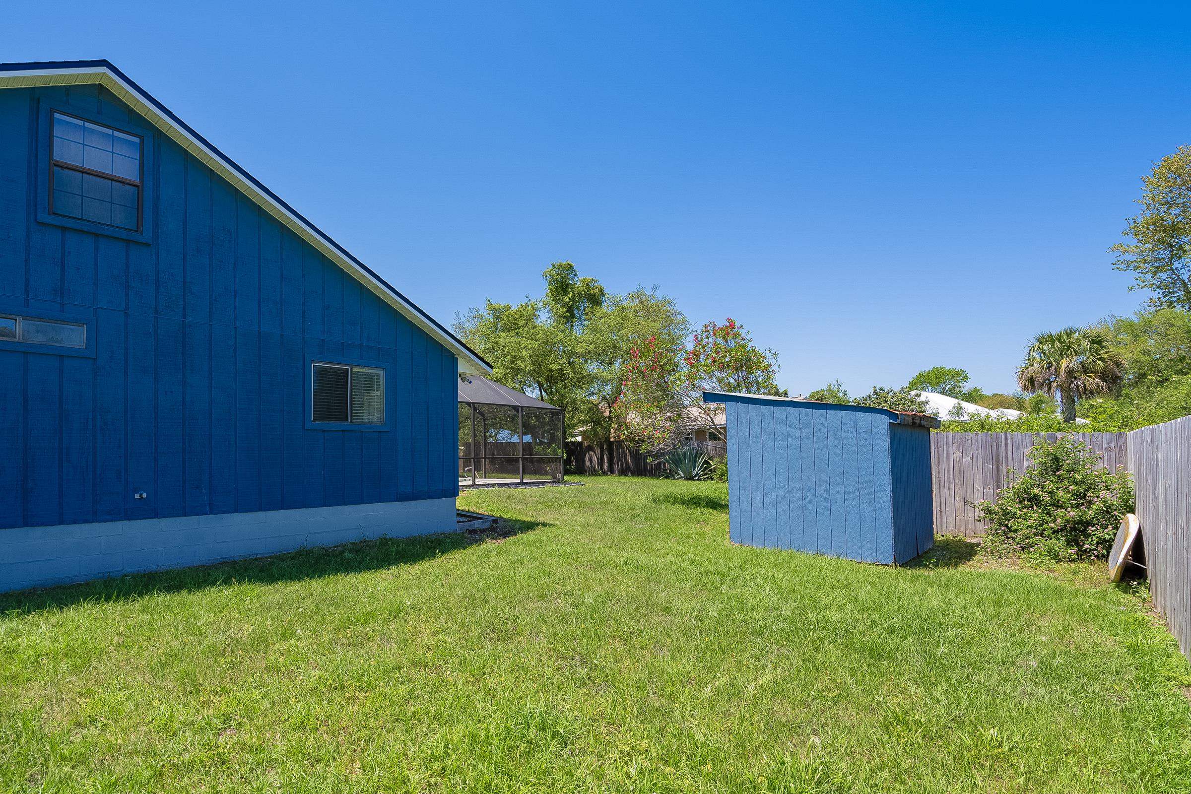 303 Sea Fox Road St. Augustine, FL 32086 - Photo 54 of 96 a view of a backyard with potted plants