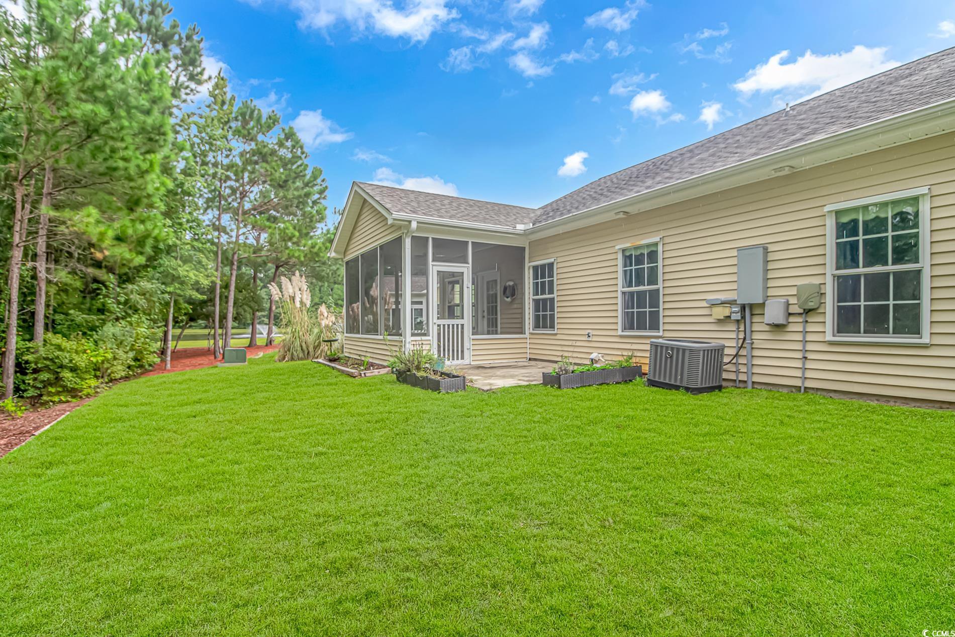 224 Rose Water Loop Myrtle Beach, SC 29588 - Photo 28 of 40 Back of house with a sunroom, central AC unit, and