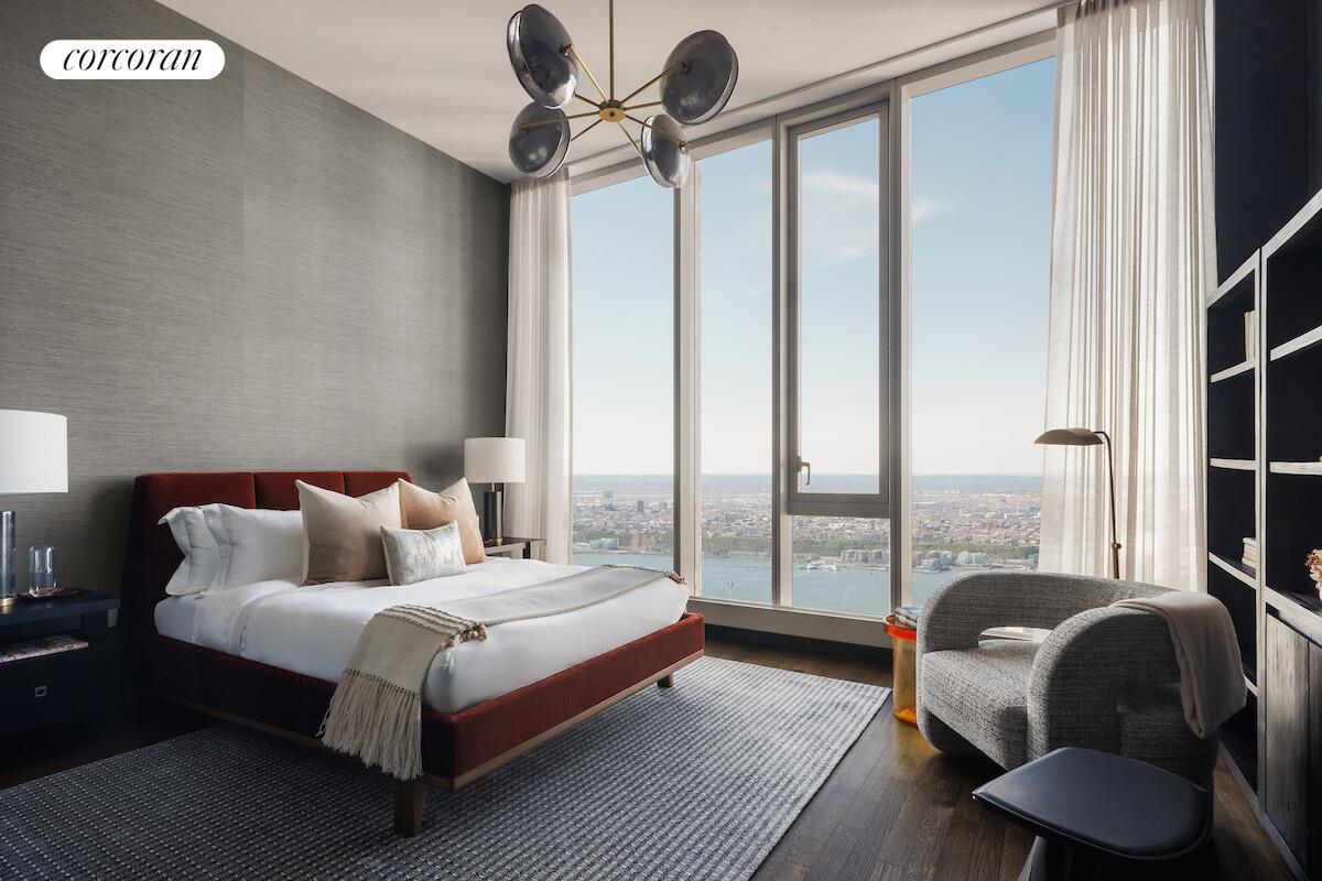 217 West 57th Street, Unit 84W Manhattan, NY 10019 - Photo 7 of 24 a bedroom with a bed and a large window