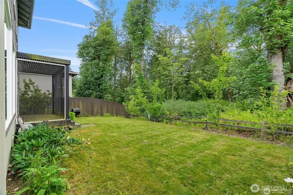 a front view of a house with a garden and plants