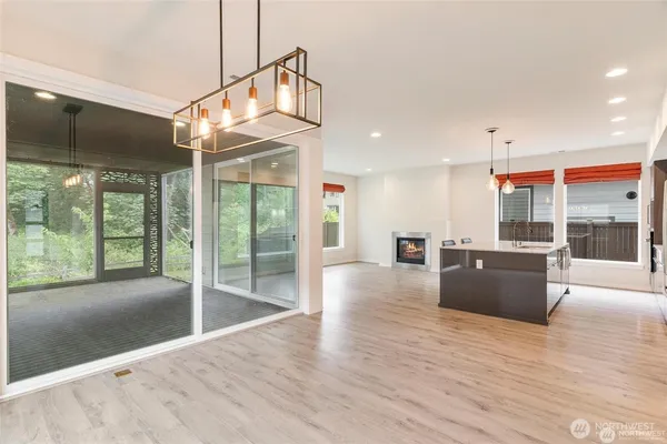 a kitchen with kitchen island a large counter top space appliances and cabinets