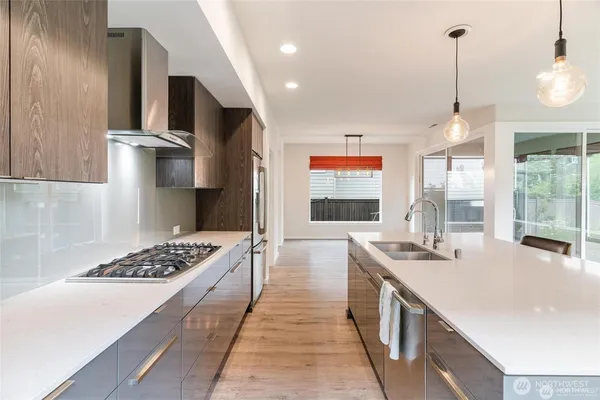 a open kitchen with a table and chairs