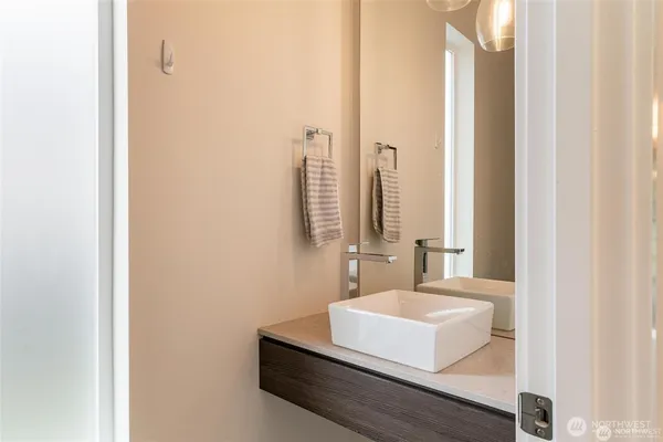 a view of a kitchen with a sink and a fireplace