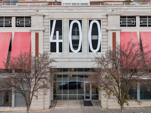 a front view of a building with large windows
