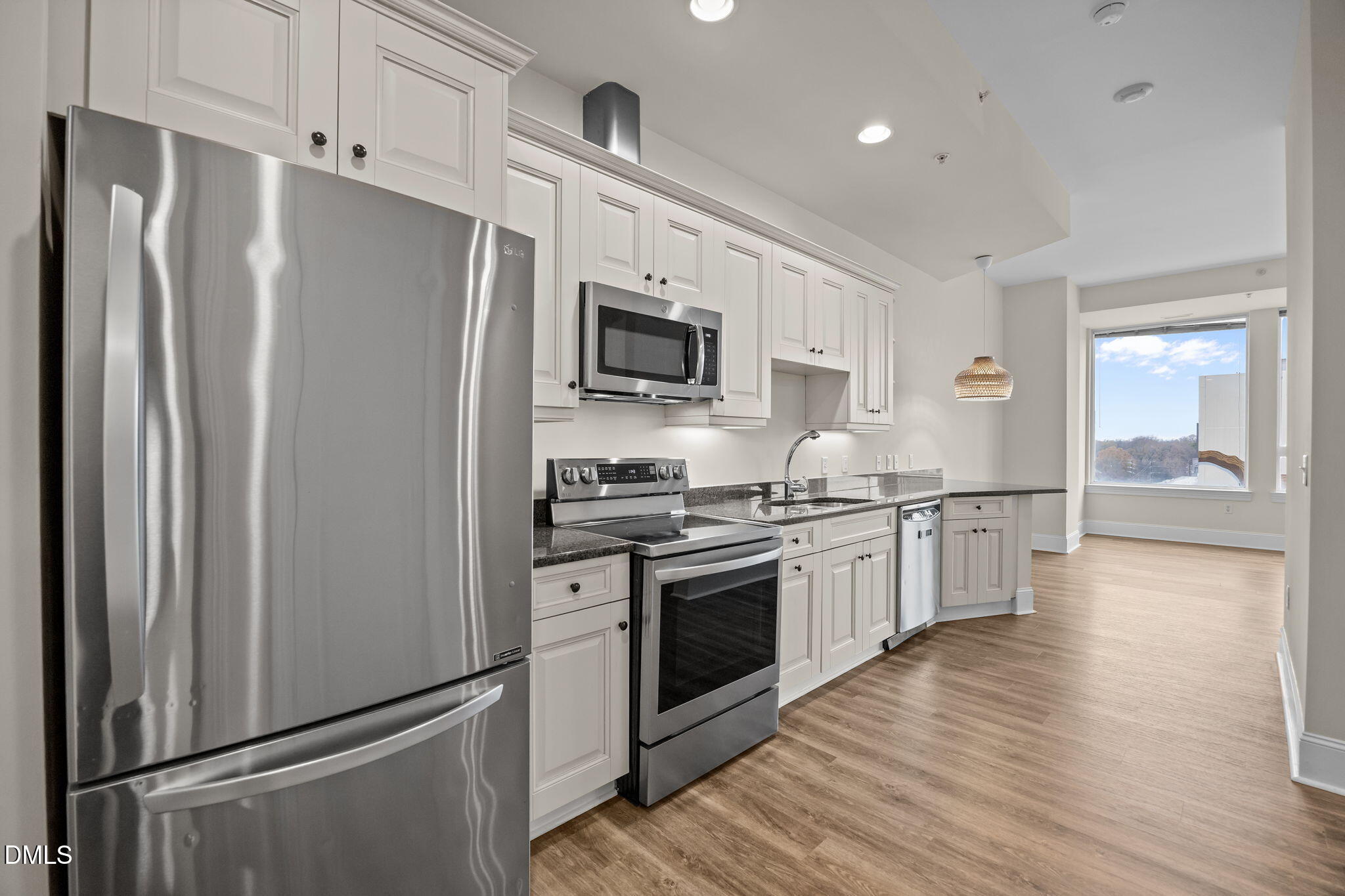 400 West North Street, Unit 814 Raleigh, NC 27603 - Photo 16 of 45 a kitchen with stainless steel appliances a refrigerator sink and microwave