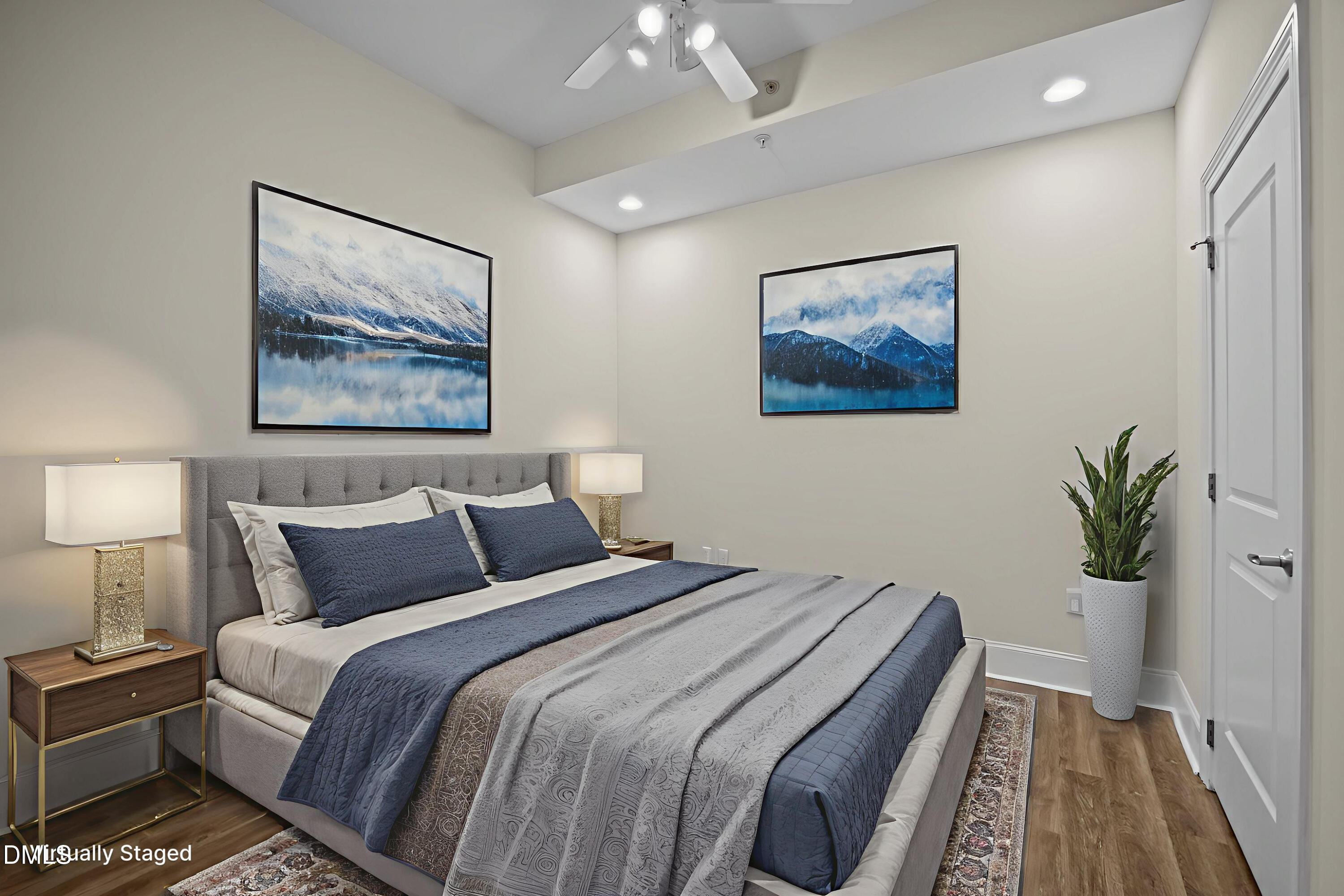 400 West North Street, Unit 814 Raleigh, NC 27603 - Photo 20 of 45 a bedroom with bed and paintings on the wall