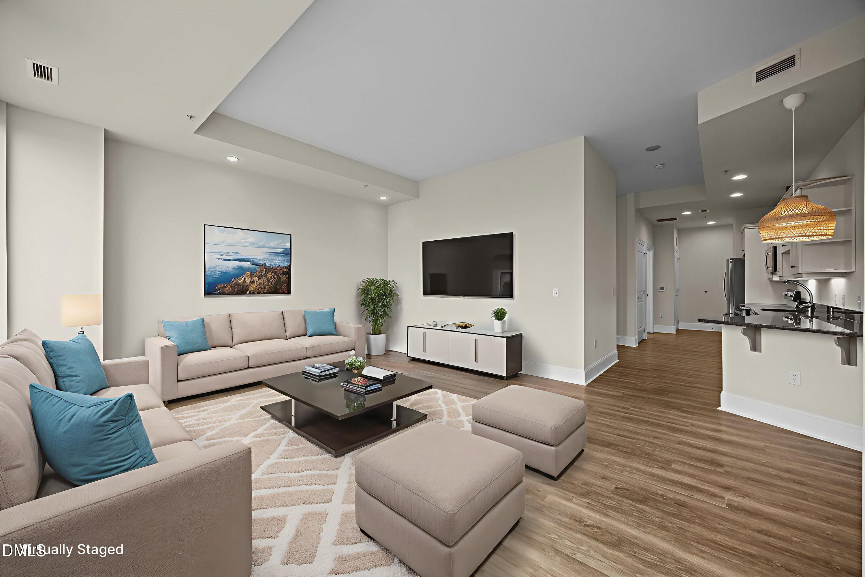 400 West North Street, Unit 814 Raleigh, NC 27603 - Photo 24 of 45 a living room with furniture and a flat screen tv