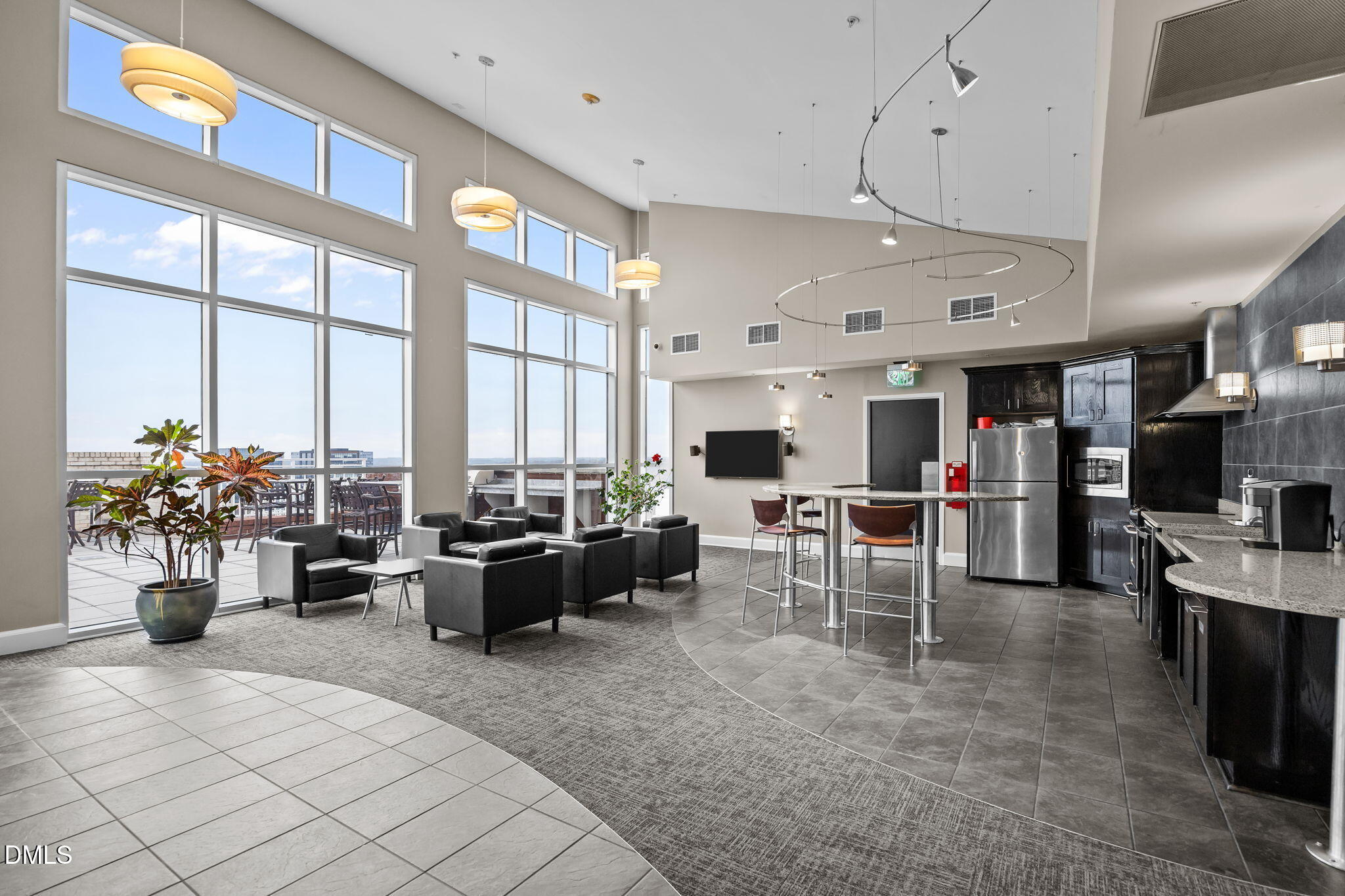 400 West North Street, Unit 814 Raleigh, NC 27603 - Photo 29 of 45 a living room with furniture a chandelier and a large window
