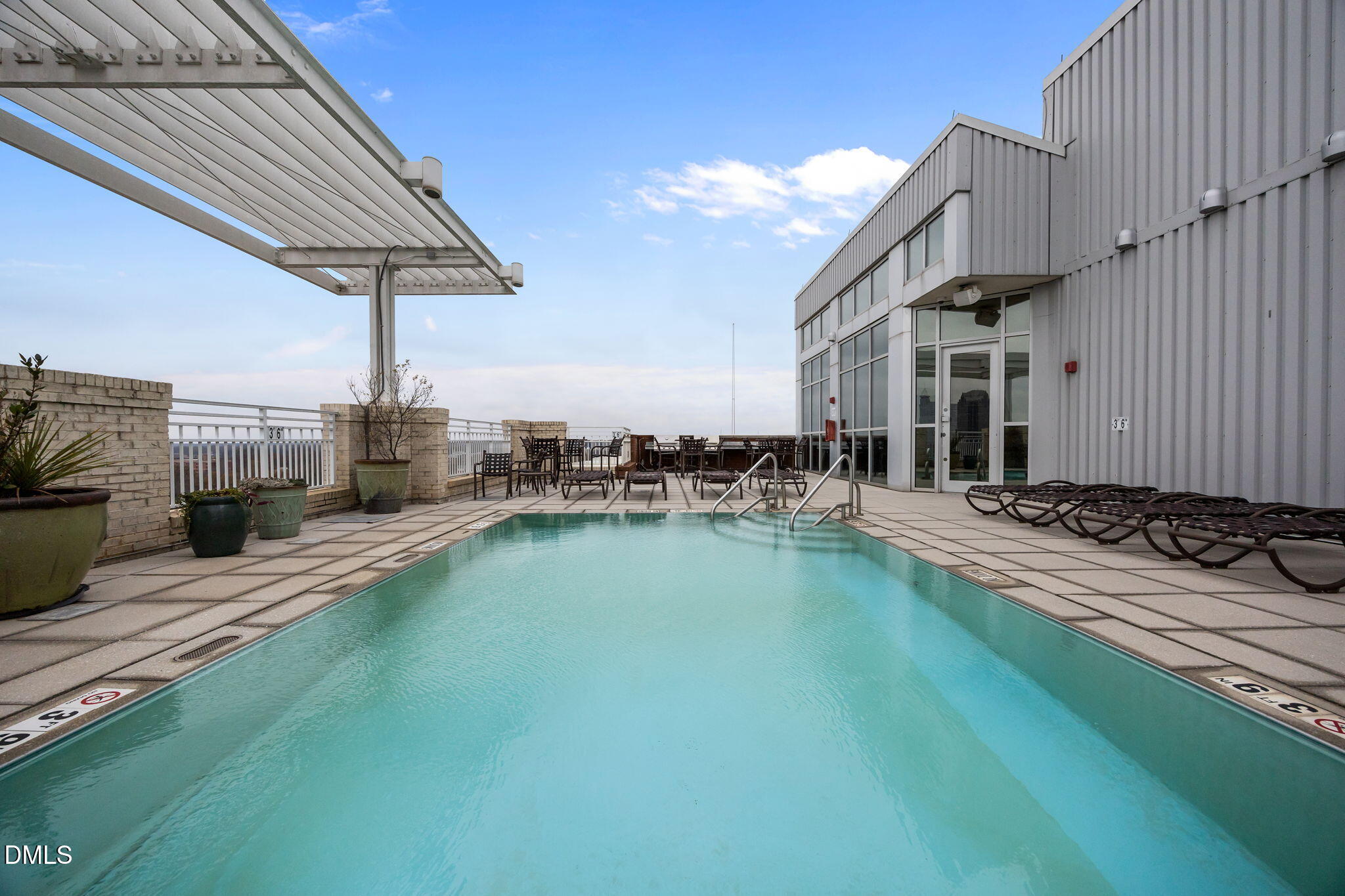 400 West North Street, Unit 814 Raleigh, NC 27603 - Photo 36 of 45 a swimming pool with outdoor seating and yard