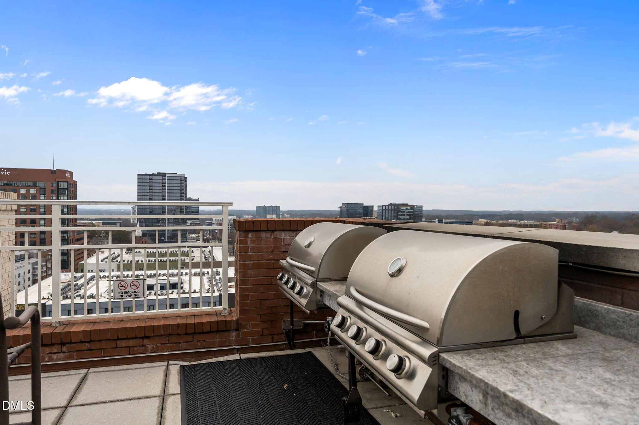 400 West North Street, Unit 814 Raleigh, NC 27603 - Photo 37 of 45 a view of a balcony with table and chairs