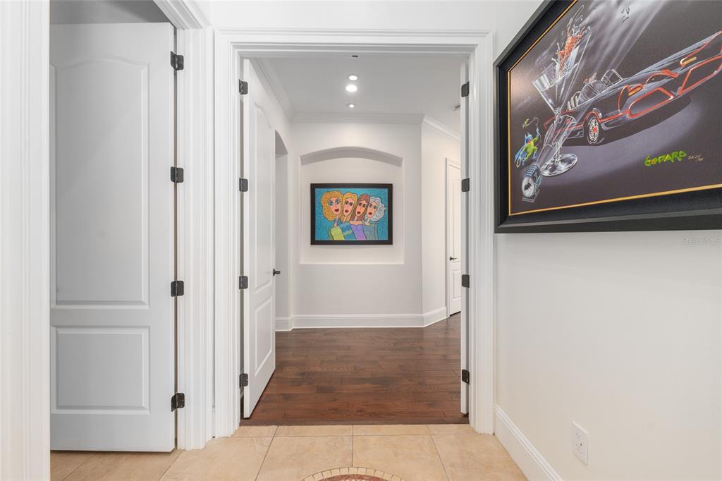 695 Southeast 47th Loop Ocala, FL 34480 - Photo 25 of 79 a view of a hallway with paintings on the wall