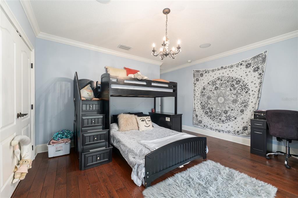 695 Southeast 47th Loop Ocala, FL 34480 - Photo 31 of 79 a living room with furniture and a chandelier