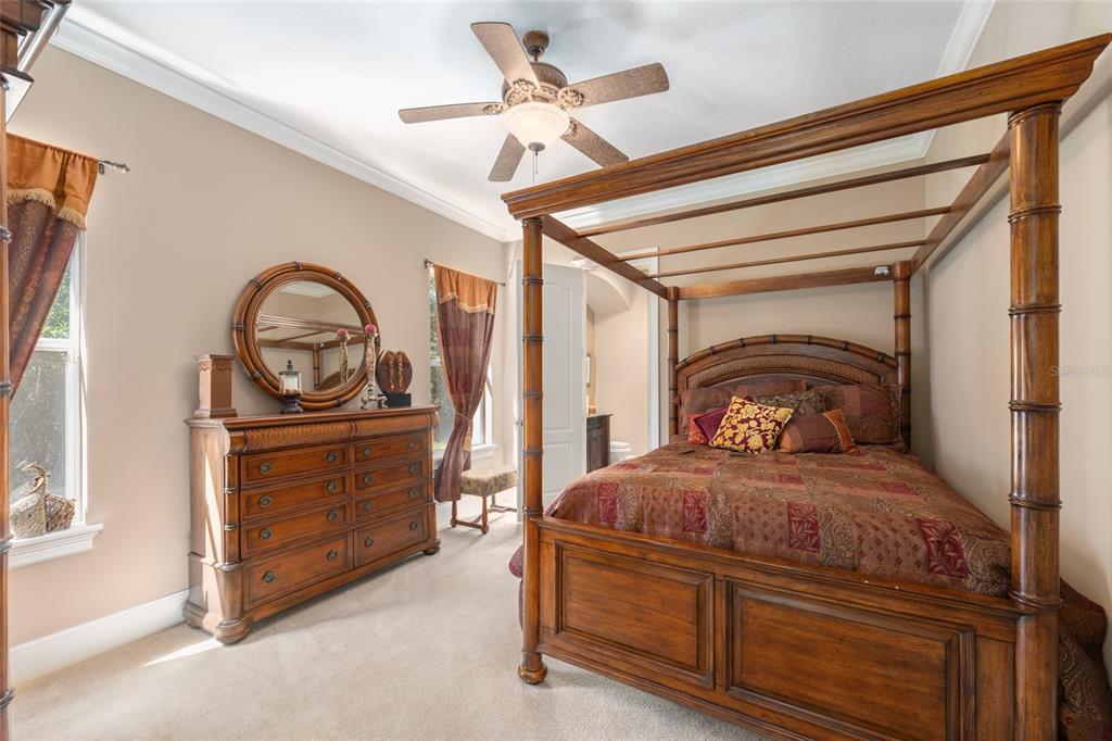 695 Southeast 47th Loop Ocala, FL 34480 - Photo 37 of 79 a bedroom with a bed and a dresser