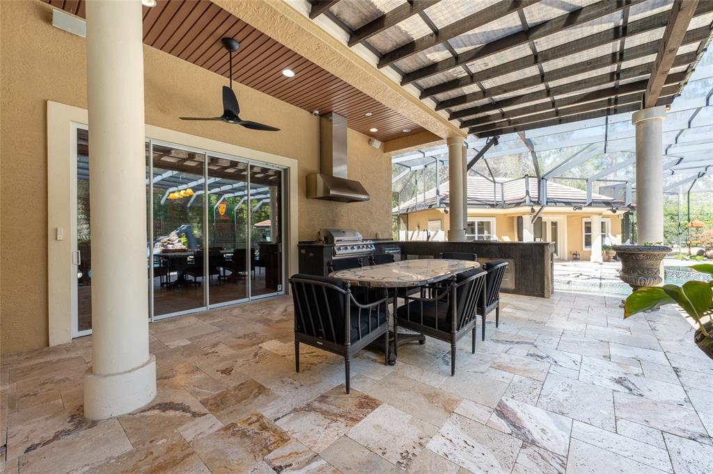 695 Southeast 47th Loop Ocala, FL 34480 - Photo 44 of 79 a view of a dinning table and chairs in the patio