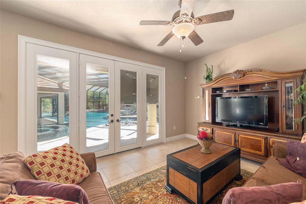 695 Southeast 47th Loop Ocala, FL 34480 - Photo 62 of 79 a living room with furniture and a flat screen tv