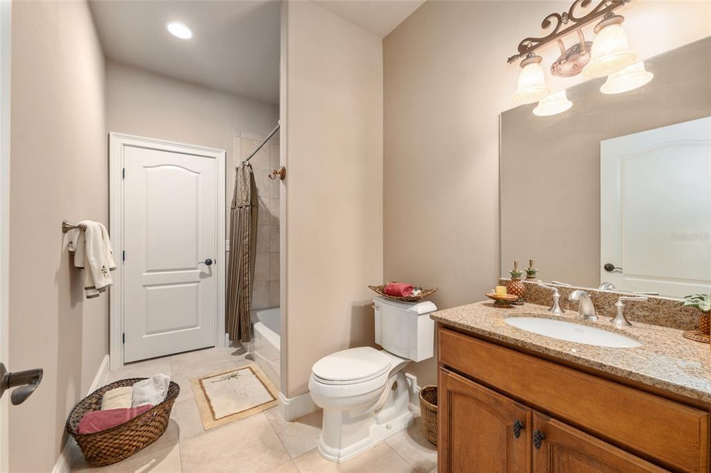 695 Southeast 47th Loop Ocala, FL 34480 - Photo 68 of 79 a bathroom with a granite countertop sink toilet and shower