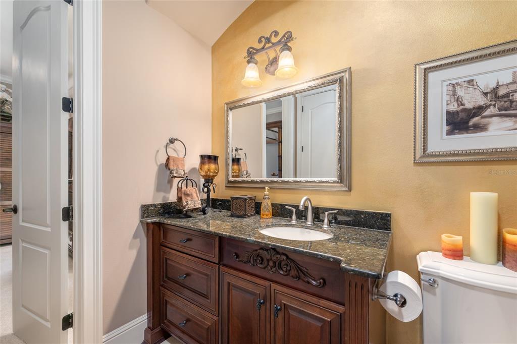 695 Southeast 47th Loop Ocala, FL 34480 - Photo 70 of 79 a bathroom with a double vanity sink and a mirror