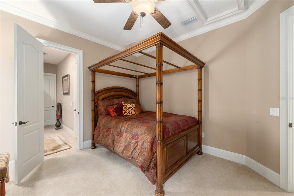 695 Southeast 47th Loop Ocala, FL 34480 - Photo 73 of 79 a bed room with a bed and a ceiling fan