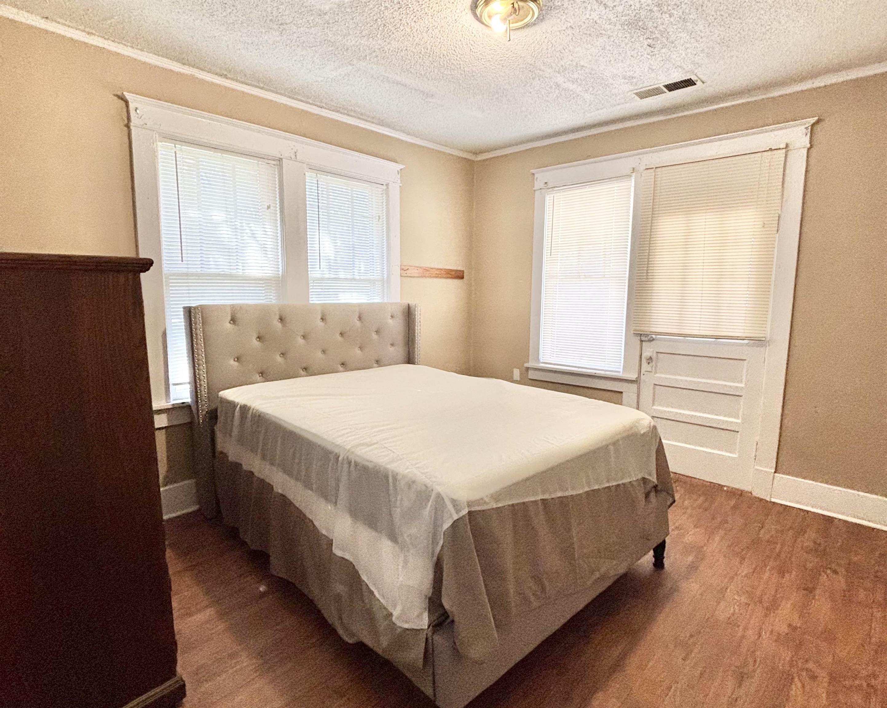 778 Atlantic Street Memphis, TN 38112 - Photo 5 of 15 a bedroom with a bed table and a window