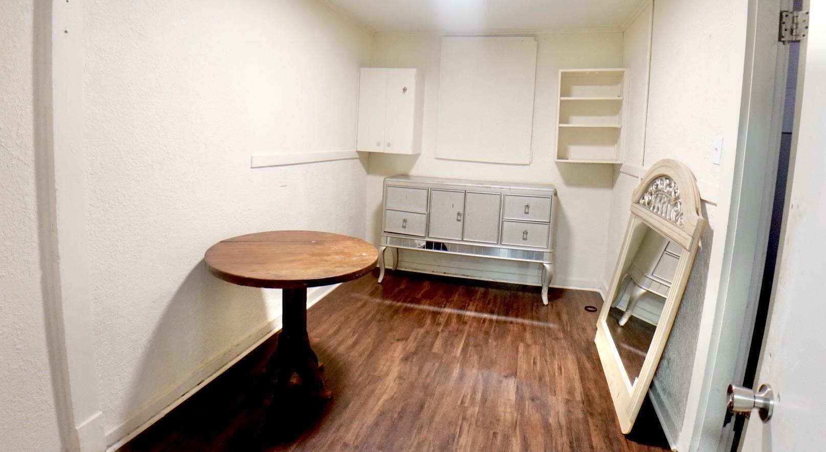 778 Atlantic Street Memphis, TN 38112 - Photo 9 of 15 a bathroom with a sink a toilet a window and a mirror