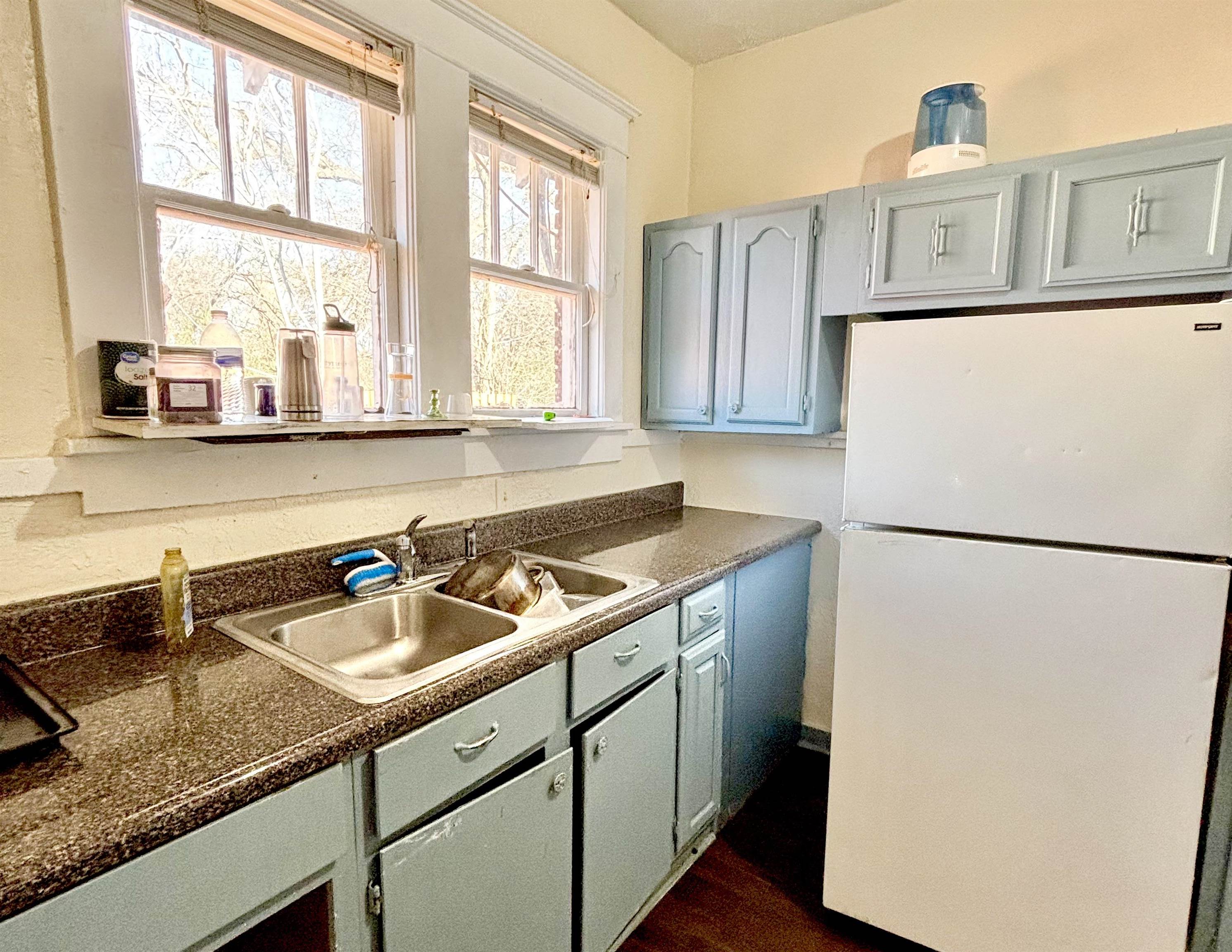 778 Atlantic Street Memphis, TN 38112 - Photo 10 of 15 a kitchen with a refrigerator a sink and a window