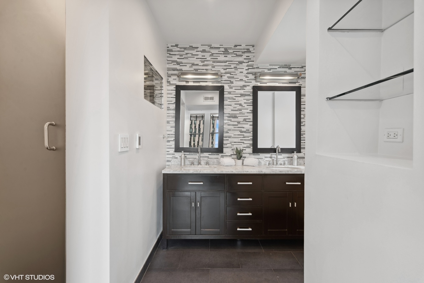 411 South Sangamon Street, Unit 2D Chicago, IL 60607 - Photo 11 of 18 a bathroom with a granite countertop sink a vanity and a large mirror