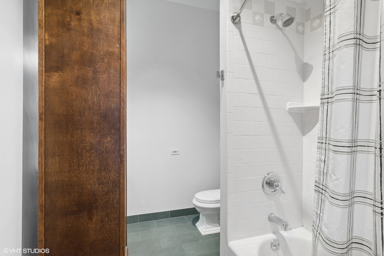 411 South Sangamon Street, Unit 2D Chicago, IL 60607 - Photo 16 of 18 a white toilet sitting next to a shower