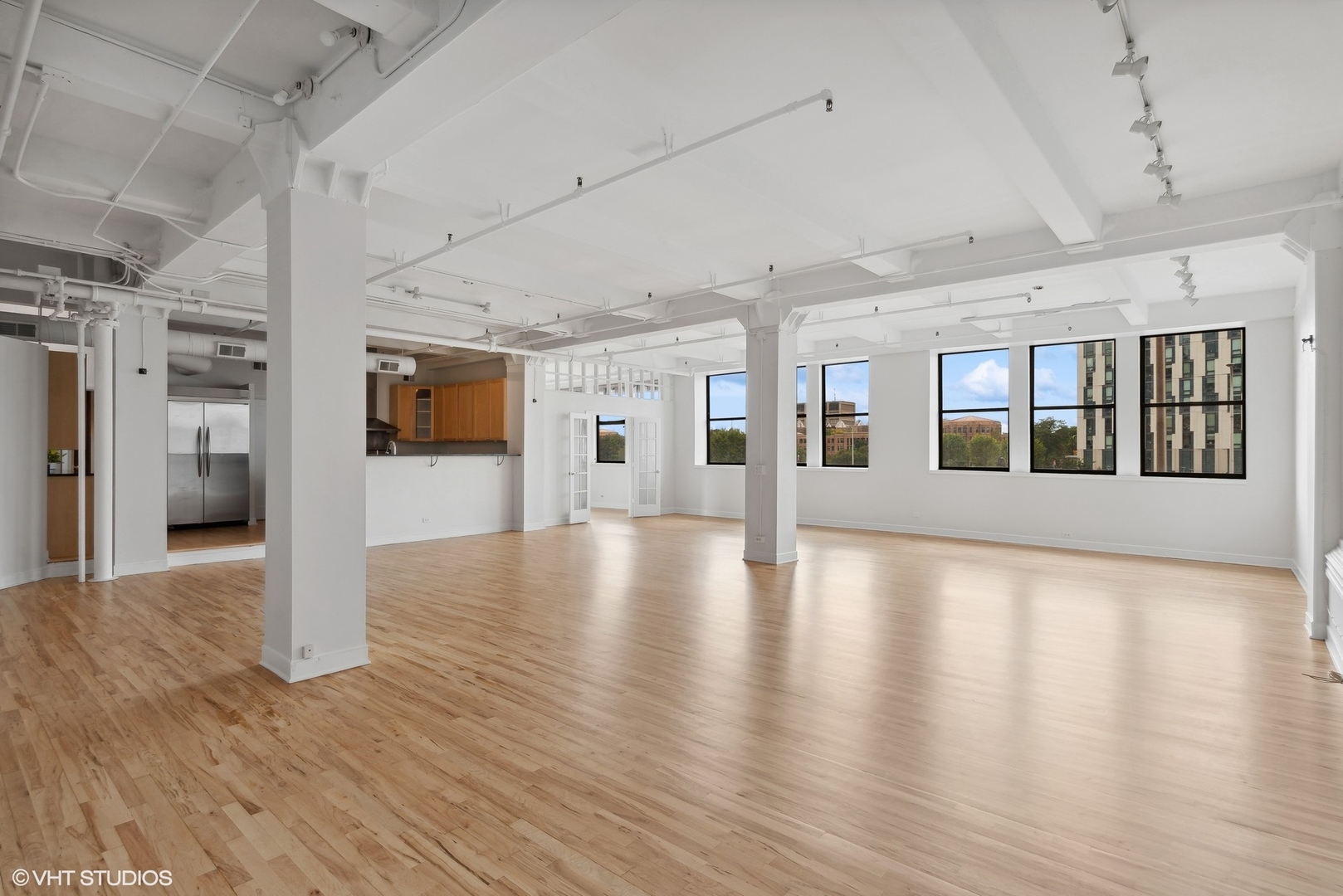 411 South Sangamon Street, Unit 2D Chicago, IL 60607 - Photo 3 of 18 a view of a big room with wooden floor