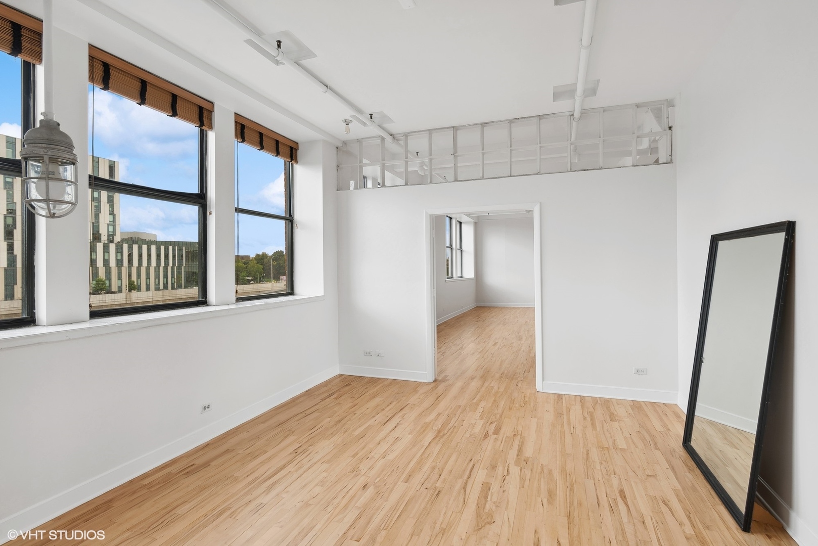 411 South Sangamon Street, Unit 2D Chicago, IL 60607 - Photo 9 of 18 a view of empty room with wooden floor and fan