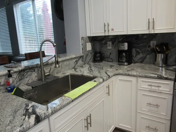 a kitchen with a sink and cabinets