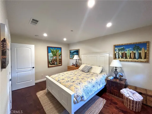 a bedroom with a bed and dresser