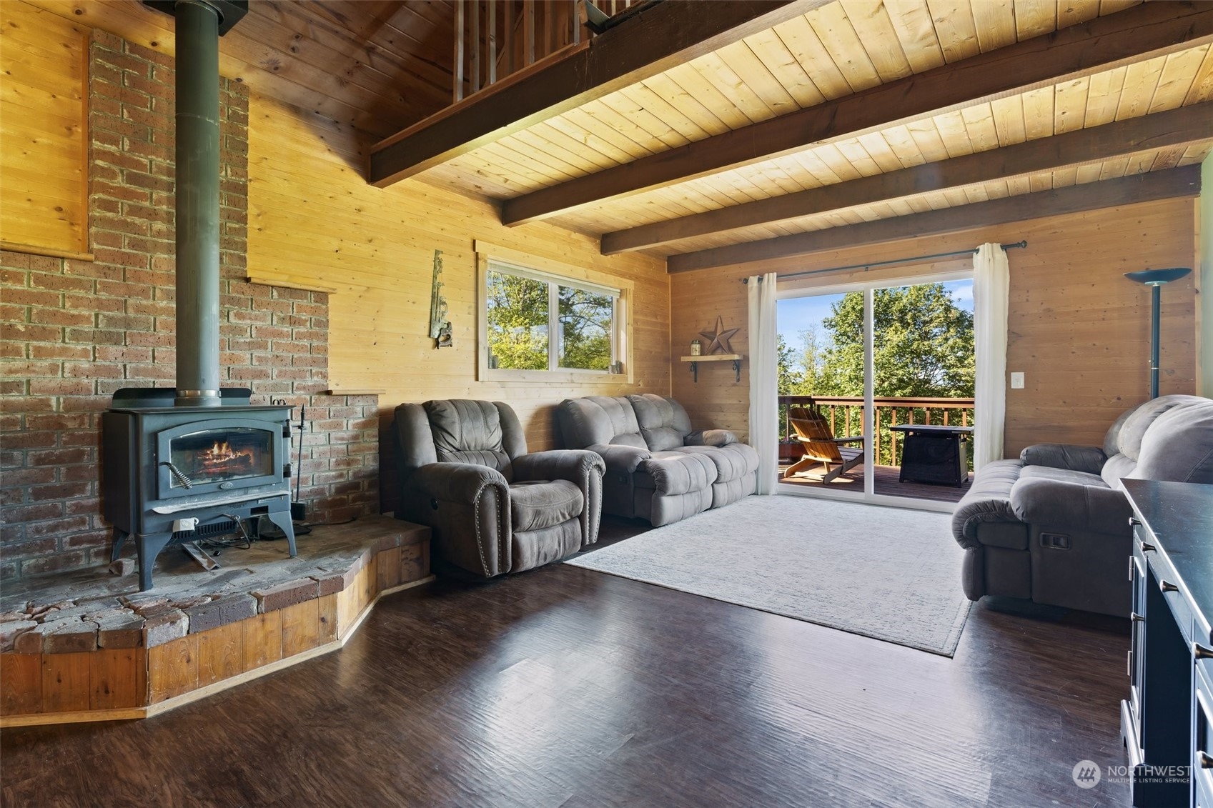 239 View Ridge Road Onalaska, WA 98570 - Photo 11 of 33 a living room with furniture large windows and wooden floor
