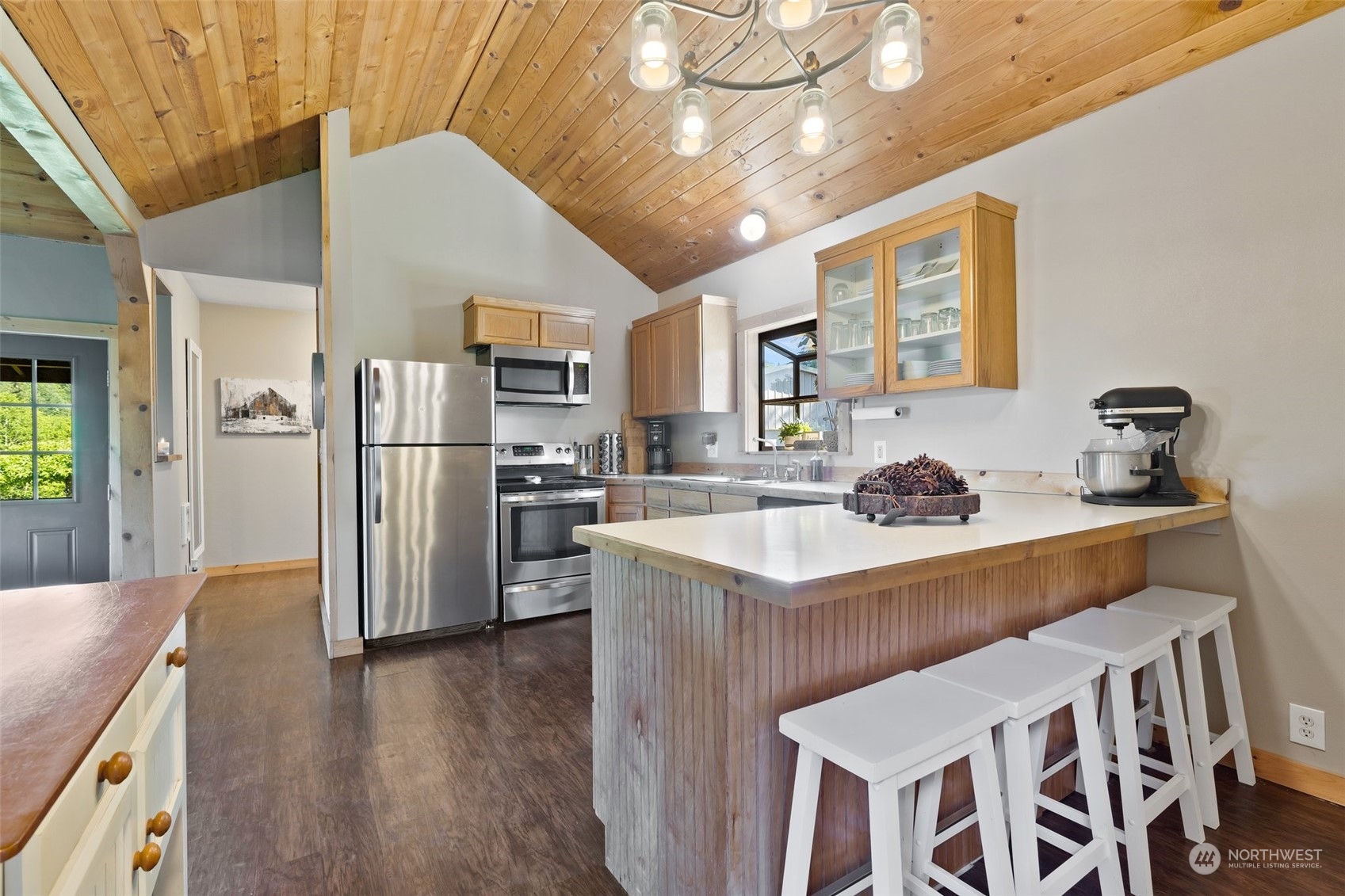239 View Ridge Road Onalaska, WA 98570 - Photo 18 of 33 a kitchen with refrigerator cabinets and wooden floor