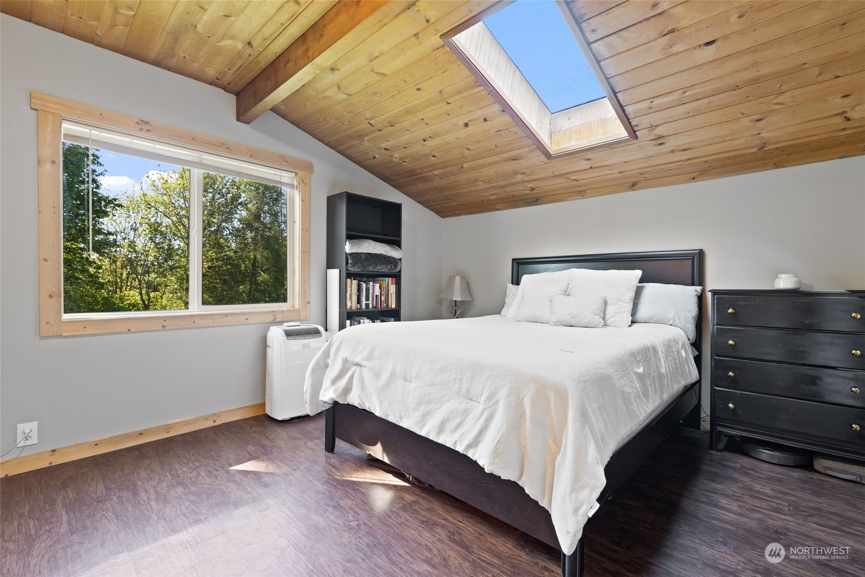 239 View Ridge Road Onalaska, WA 98570 - Photo 20 of 33 a large bed sitting in a bedroom next to a window