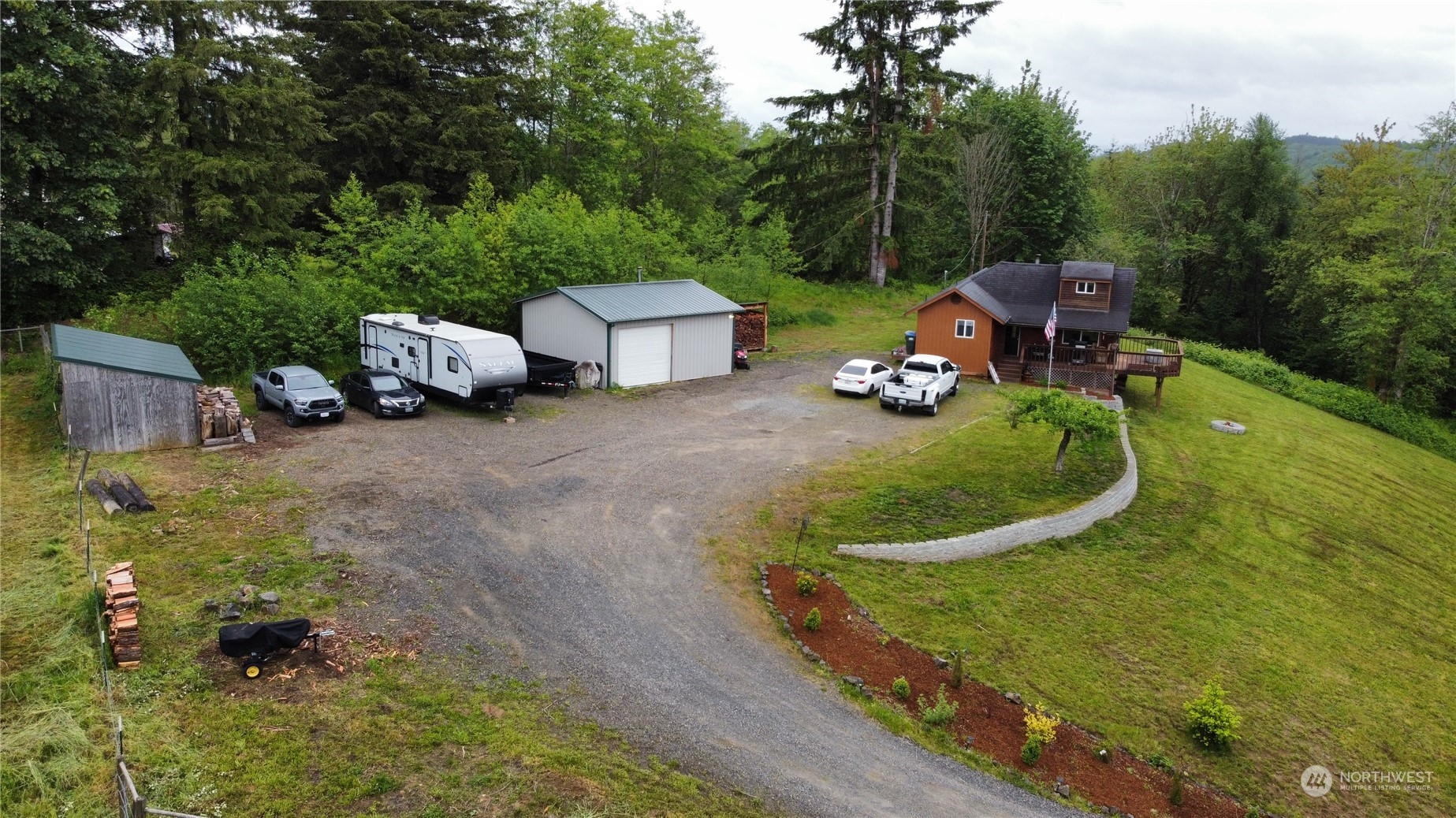 239 View Ridge Road Onalaska, WA 98570 - Photo 33 of 33 a view of a chair and fire pit in the garden