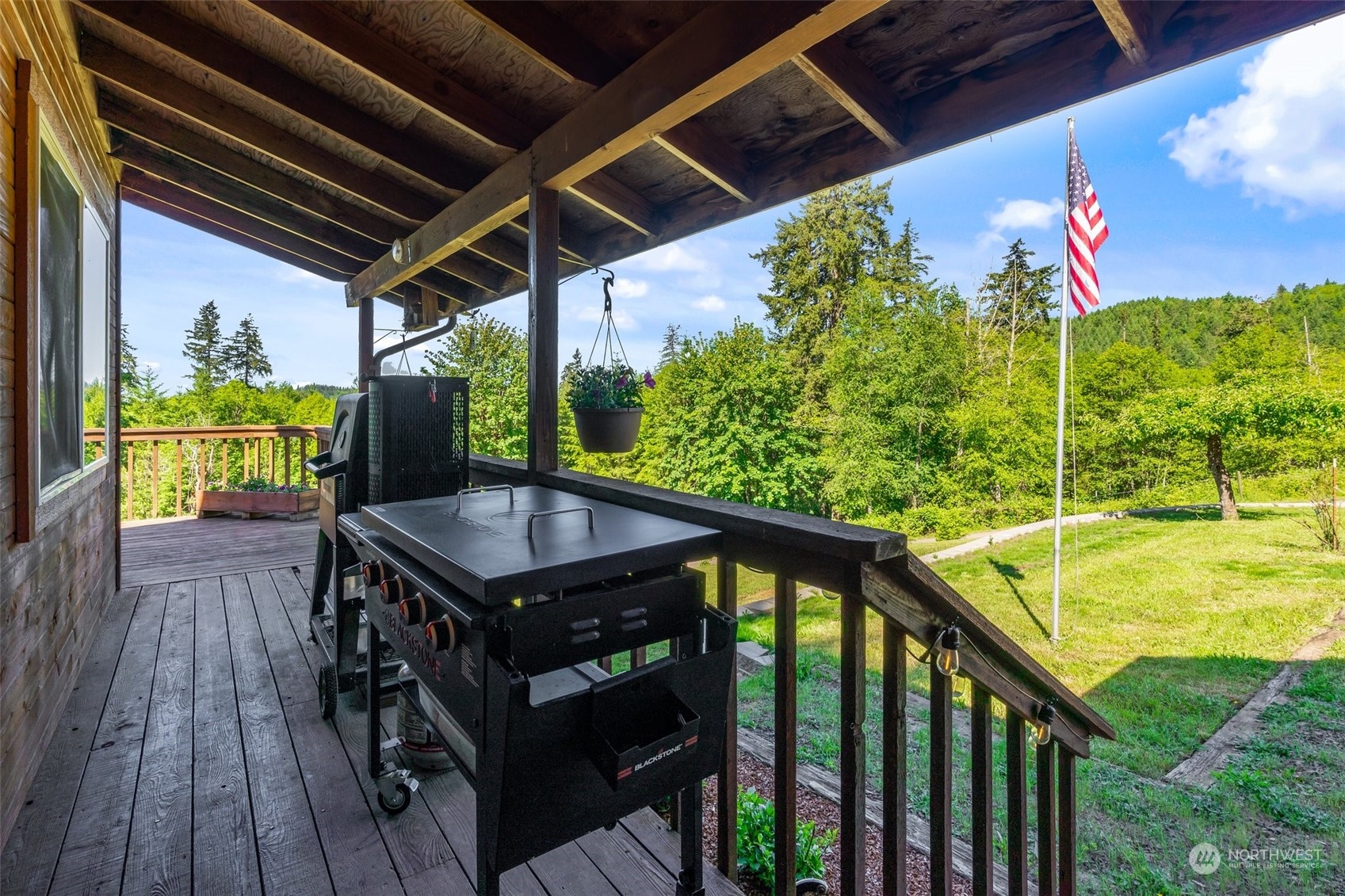 239 View Ridge Road Onalaska, WA 98570 - Photo 8 of 33 a view of a balcony with wooden floor and outdoor seating