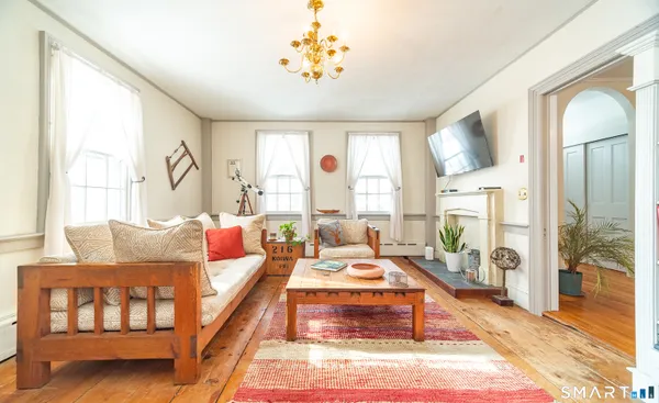 a living room with furniture and a table